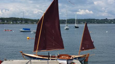 2014 19' Ness Yawl Designed by Ian Oughtred, in water docked sails up