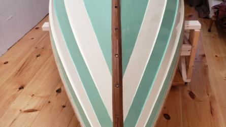 Fancy dinghy, rowboat, yacht tender, Chaisson Dory, view of bottom in storage
