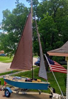 FAMILY TIME at home on trailer with sails full and US flag in front driveway.