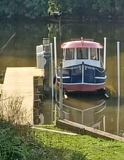 14' Candu-EZ Mini Tug by Berkeley Engineering., on lift in water, looking at bow