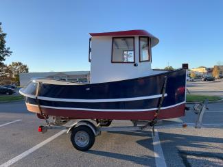 14' Candu-EZ Mini Tug by Berkeley Engineering., on trailer starboard side view