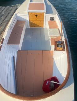 1923 Cape Cod Power Dory , view of deck from above looking toward stern, in water docked