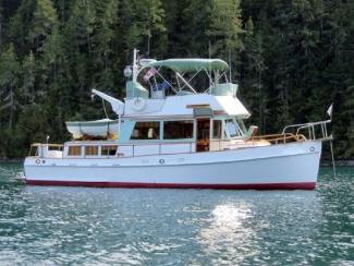Well Maintained True Classic Grand Banks, in water starboard side