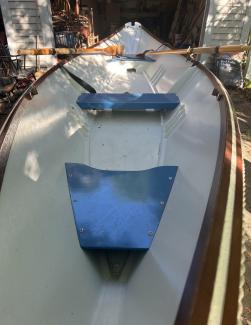 Custom wooden row boat, on trailer looking avove towards stern