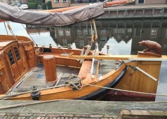 GROOTE BEER, classic flat bottomed Dutch Botteryacht, view of port side stern and deck, bear statue