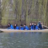 Brooks and students aboard the boat in the Japan House pond.