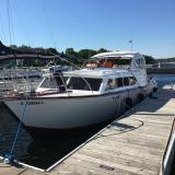 1963 Chris-Craft Futura 33', docked port side bow view