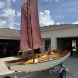 CLC Passagemaker Dinghy, on tariler sail up portside view