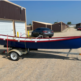 John Welsford Seagull Dory, on trailer starboard side view no cover