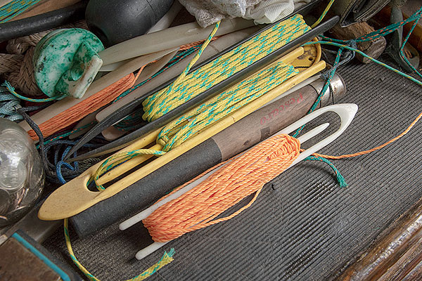shuttles and needles for repairing nets.
