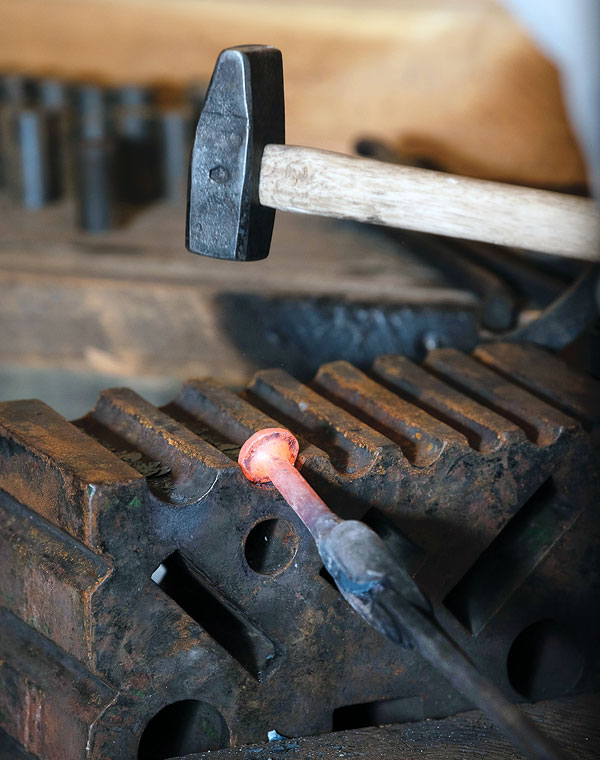 Med works the head and handle into a uniformly round shape.