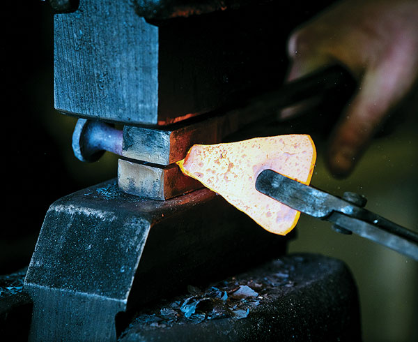 Working on the handle with the spring swage.