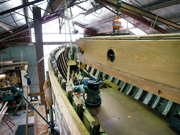 The teak coach roof was suspended above the hull.