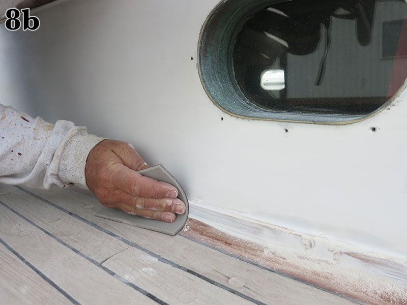 A second coat of primer is hand-sanded.