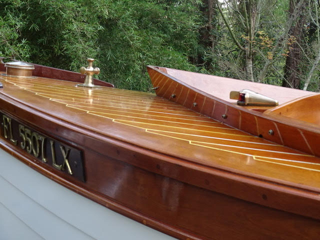 Framed in purpleheart (Peltogyne) and elegantly dressed in Honduras mahogany, decks inlaid in Douglas fir and hull in western red cedar.