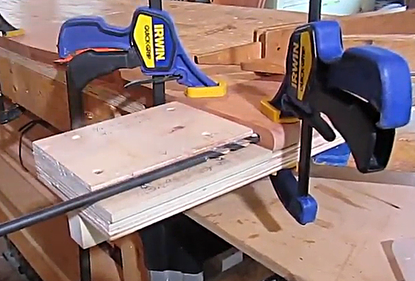 Clamps holding wood in place.