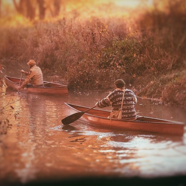 A Pair of Solo Canoes Working Upstream - Ashes Still Water Boats Solo Canoe for Cedar Strip Construction - From Ashes Still Water boats.