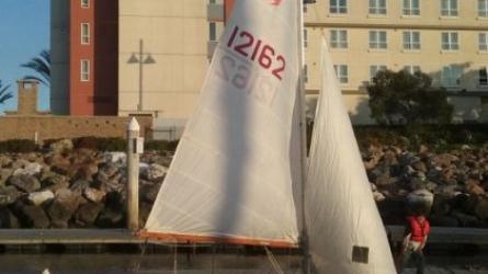 Snipe with sails up.