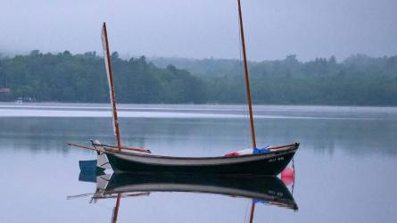 2014 Oughtred Caledonia Yawl 19', in water reflecting in the  magical mystic