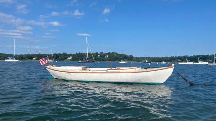 1923 Cape Cod Power Dory , in water  moored, starboard side view blue sky day