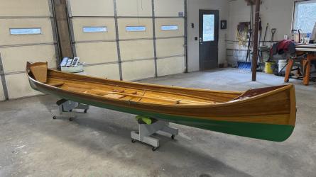 New Adirondack Guide Boat for Sale, on stands, inside