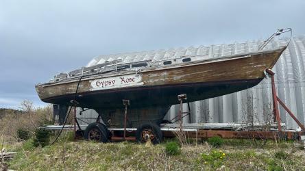 1964 Marconi-rigged 37' Wooden Sailboat, full long view, on the hard view of starboard side