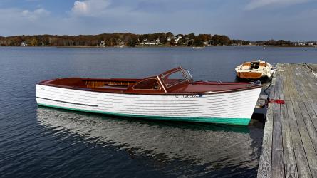 '57, 23' Lyman, runabout, docked starboard side view