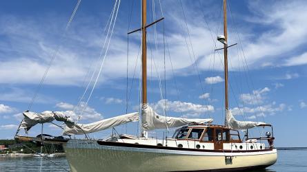 Pilothouse ketch, in water port side view