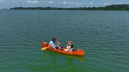 Wooden Canoe With Ribs Curved Bow 12', in water with people
