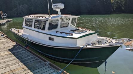 Tolman Jumbo 24, in water docked starboard side