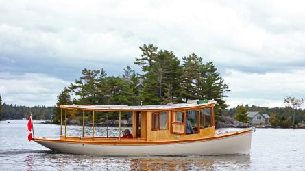 Sparks 30' electric/solar/diesel , in water full starboard side view