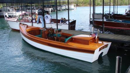 William Hand-like motor launch Custom-built mahogany, palope & cedar William Hand style motor launch, designed by Harry Bryan and owner, and powered by a 4 stoke Honda in stern cabinetry. The launch is on a galvanized, torsion bar suspended trailer with new tires.