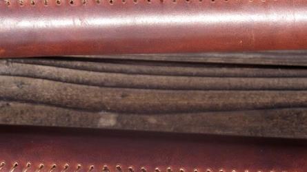 Stitching on oar leathers.