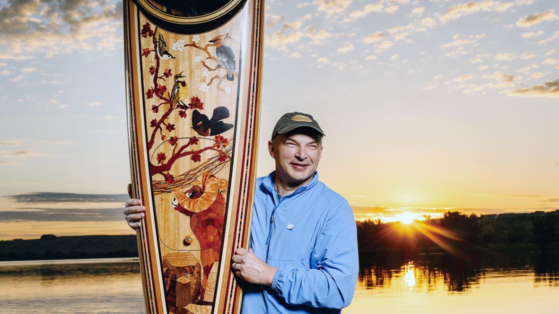 Dave Lake holding kayak