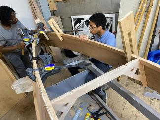 The CNC redesign installed in the boat as the chine logs go on.