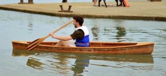 Tristan trying out the canoe for the first time at the launch. 