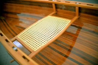 Canoe seat is a Douglas fir frame with a synthetic cane weave centre