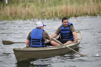 Cattail with two of her builders, enjoying a row on the Miles River at CBMM