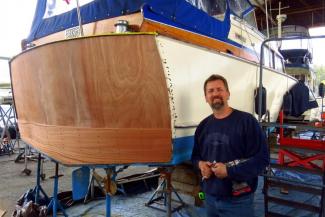 Iverson removed the rotten wood and hand-crafted and custom-fit the beautiful new sapele mahogany transom.