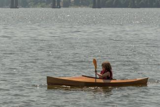 FLORA B., a Chesapeake Light Craft Wood Duckling kayak.