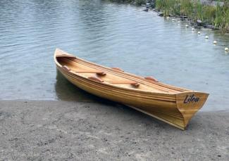 Cedar strip planked row boat.