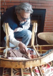 Grandpa checks on the newborn