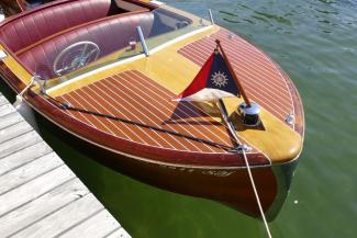 1953 Chris Craft speed boat, docked starboard side bow view
