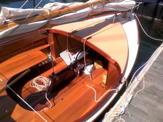BILL GARDEN 12FT “TOMCAT” CATBOAT, docked starboard side, upclose view inside