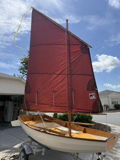 CLC Passagemaker Dinghy, on trailer sail up port side bow view