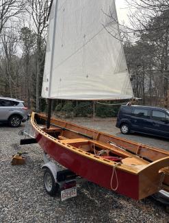 Goat Island Skiff, on trailer sail up view from stern side port side view