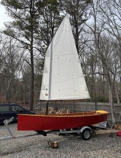 Goat Island Skiff, on trailer, sail up, port side view