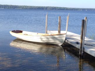 Penobscot 13 wooden sailboat boat for sale, in water, docked, starboard bow view