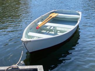 12' wood skiff, docked bow port side view