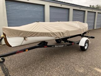 CW Barrett Bros Rangeley  , on trailer covered port side view